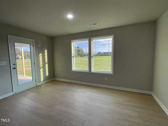 53 Grace Ridge Ct, Benson, NC 27504 - empty room featuring baseboards, recessed lighting, wood finished floors, and visible vents