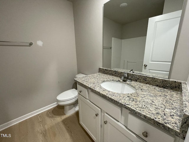 53 Grace Ridge Ct, Benson, NC 27504 - bathroom featuring toilet, baseboards, wood finished floors, and vanity
