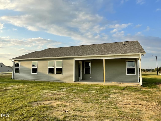 53 Grace Ridge Ct, Benson, NC 27504 - rear view of property featuring a yard and a shingled roof