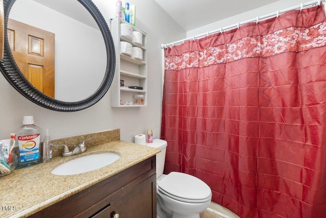 bathroom featuring vanity, toilet, and a shower with curtain