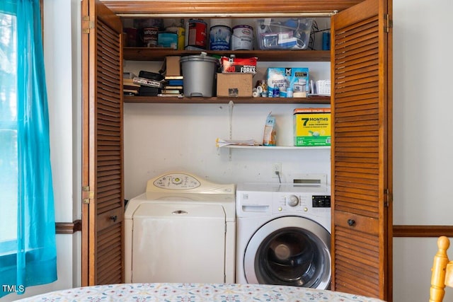 washroom featuring washing machine and dryer