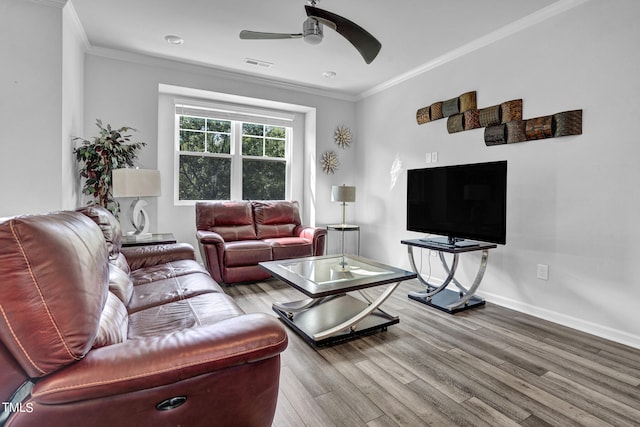 living room featuring ornamental molding, ceiling fan, and hardwood / wood-style flooring