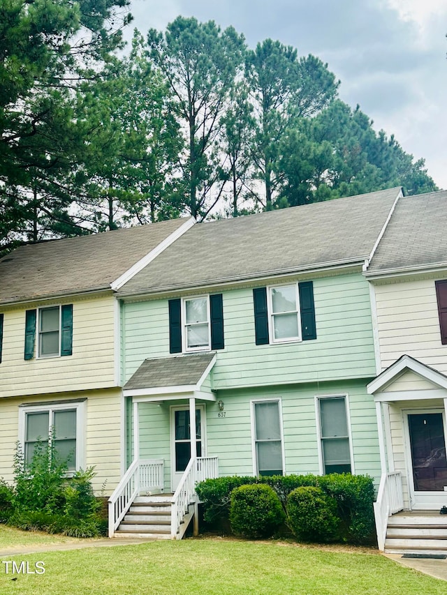 view of property featuring a front yard