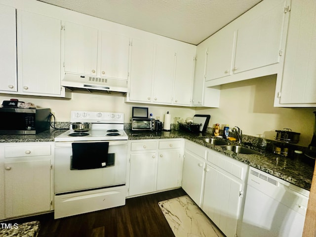 kitchen with white cabinets, white appliances, a textured ceiling, dark hardwood / wood-style floors, and sink