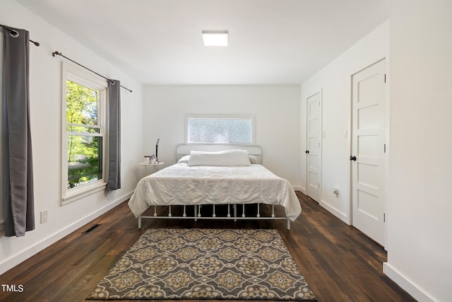 bedroom featuring dark hardwood / wood-style flooring