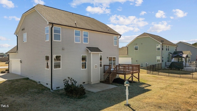 rear view of house featuring a lawn, crawl space, stairway, a deck, and a shingled roof