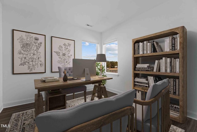 home office with dark wood-style flooring, baseboards, and visible vents