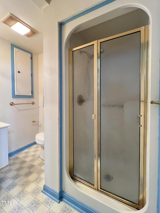 full bath featuring a shower stall, baseboards, and tile patterned floors