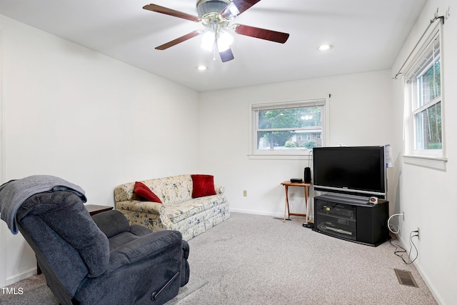 carpeted living room with ceiling fan, recessed lighting, visible vents, and baseboards