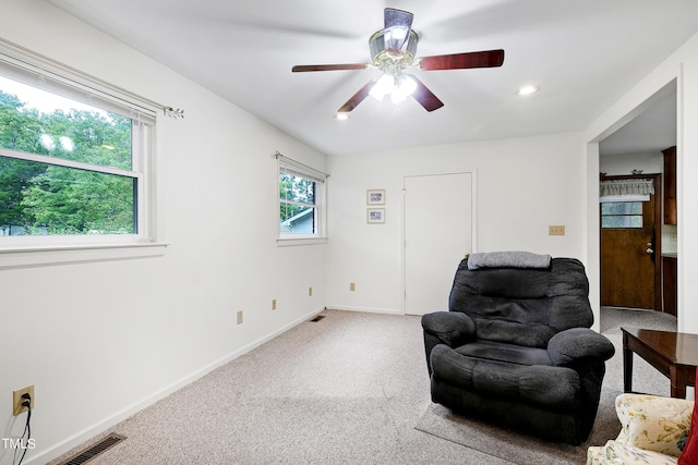 living area with recessed lighting, carpet floors, a ceiling fan, visible vents, and baseboards