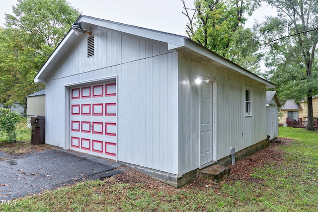 detached garage featuring driveway