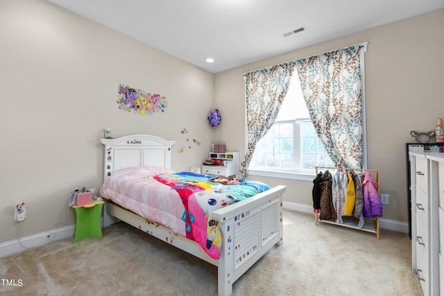 bedroom with light colored carpet