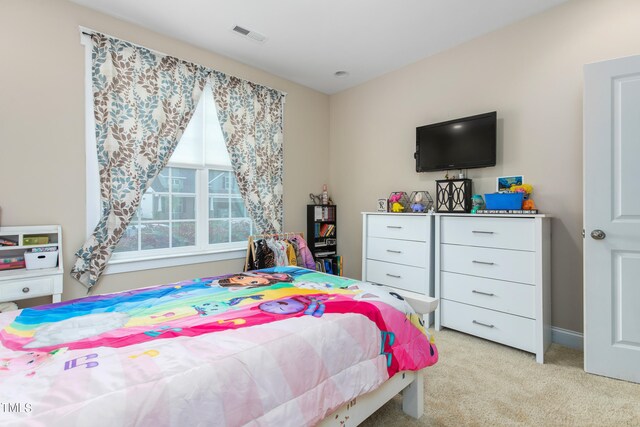 bedroom featuring light colored carpet