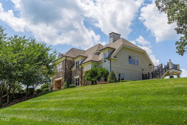 view of side of property featuring a yard