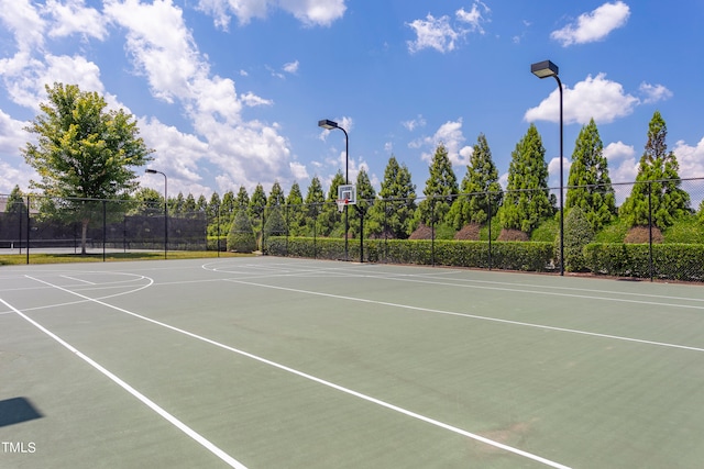 view of sport court with basketball hoop