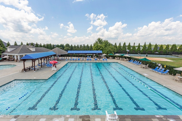 view of pool with a patio and a gazebo