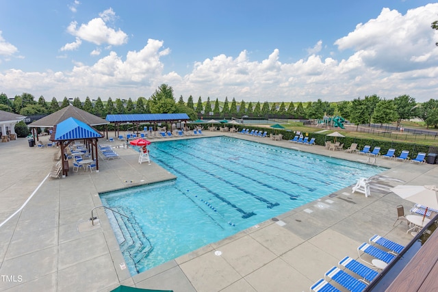 view of swimming pool with a patio and a gazebo