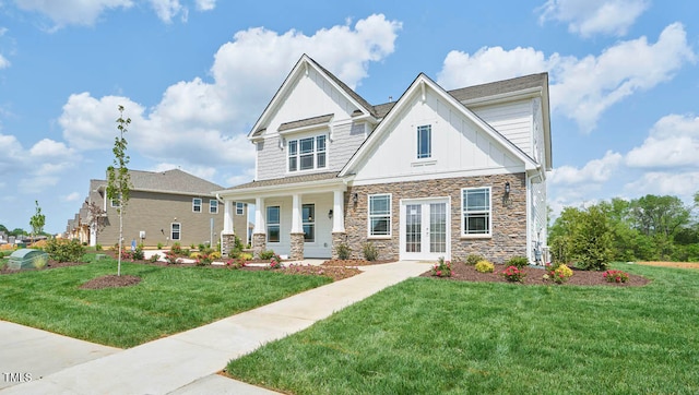 craftsman inspired home featuring a porch and a front lawn