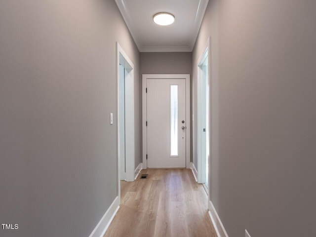 doorway to outside with light wood-type flooring