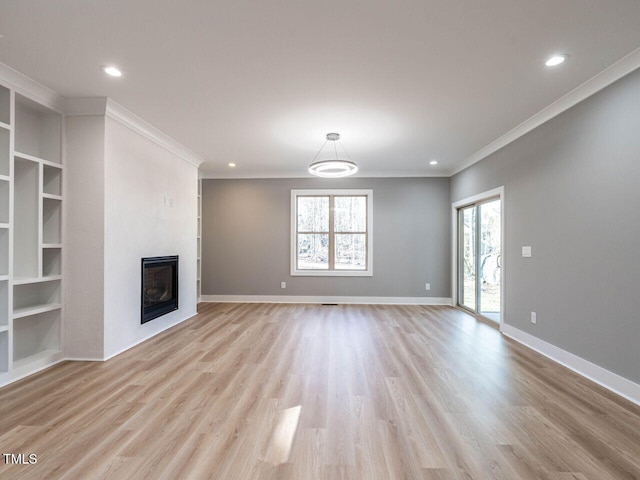 unfurnished living room featuring light hardwood / wood-style floors and crown molding