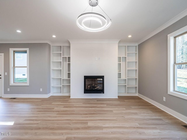 unfurnished living room with light hardwood / wood-style flooring and ornamental molding