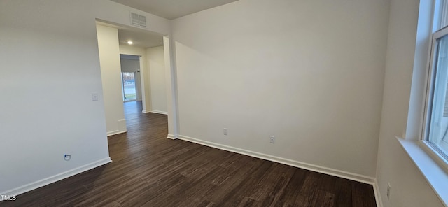 empty room featuring dark hardwood / wood-style floors