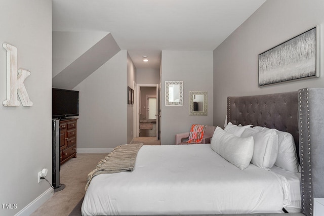 bedroom featuring light colored carpet