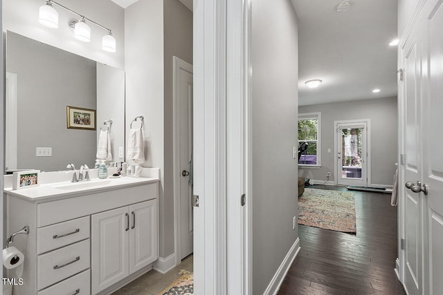 bathroom with vanity and hardwood / wood-style floors