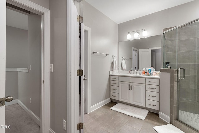 bathroom with vanity and an enclosed shower