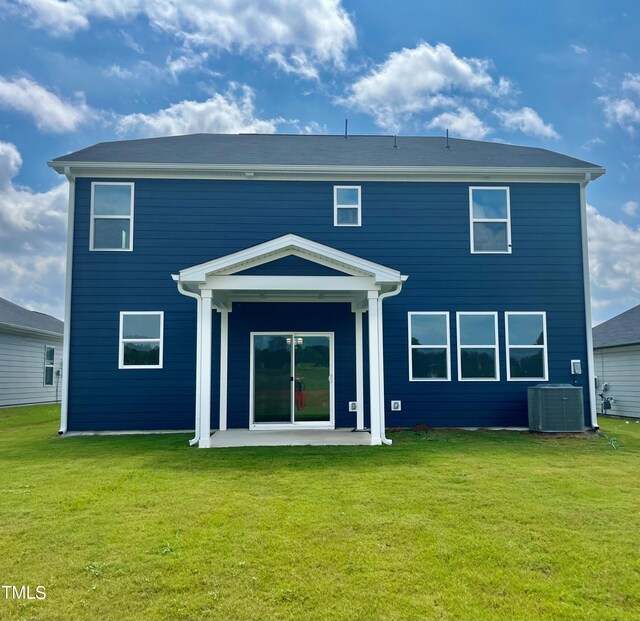 back of property featuring a yard, a patio, and central AC unit