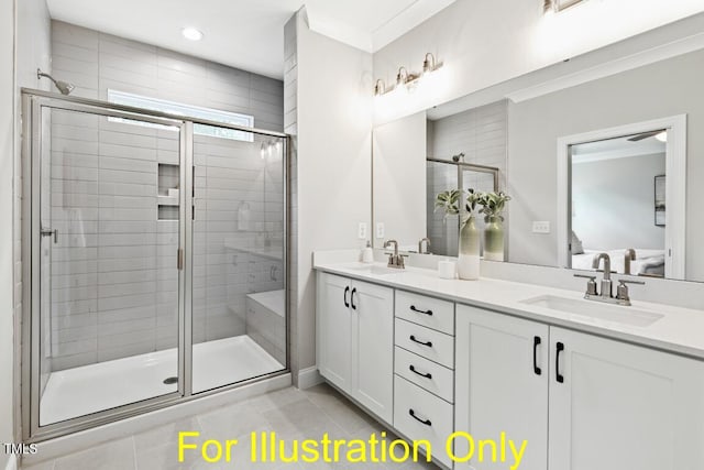 bathroom with a shower with door, vanity, and tile patterned floors