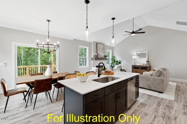 kitchen with lofted ceiling, sink, a center island with sink, dishwasher, and light hardwood / wood-style floors