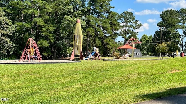 surrounding community with a playground and a lawn