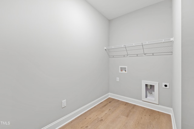 washroom featuring hookup for a washing machine, hookup for an electric dryer, and light wood-type flooring