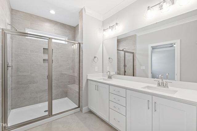 bathroom featuring vanity and a shower with shower door