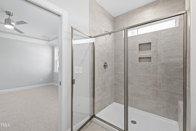 bathroom with walk in shower, ceiling fan, and plenty of natural light