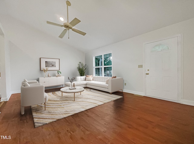 living room featuring lofted ceiling, dark hardwood / wood-style flooring, and ceiling fan