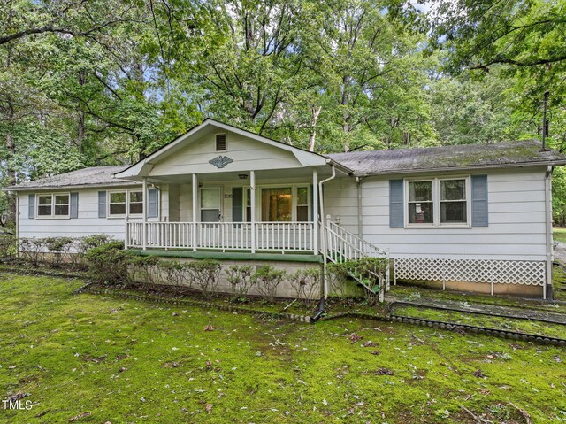 view of front of property with a front lawn and a porch