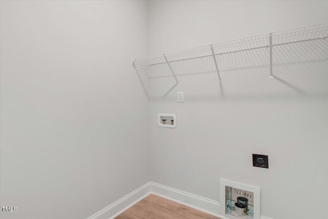 clothes washing area featuring hookup for a washing machine, hardwood / wood-style floors, and hookup for an electric dryer