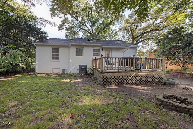 back of house featuring a lawn, cooling unit, and a deck