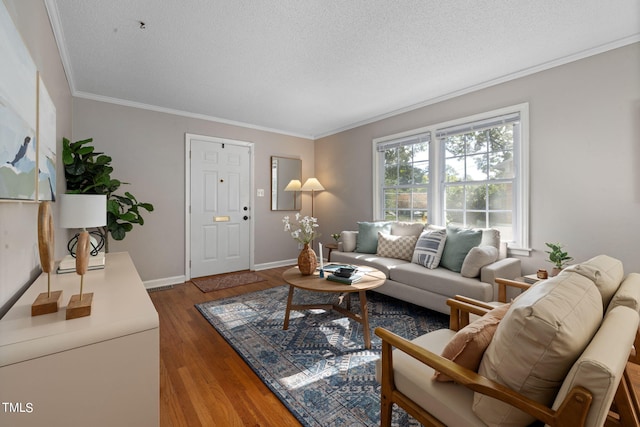 living room with a textured ceiling, hardwood / wood-style floors, and crown molding