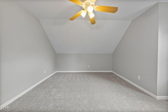 bonus room with lofted ceiling, ceiling fan, and carpet floors