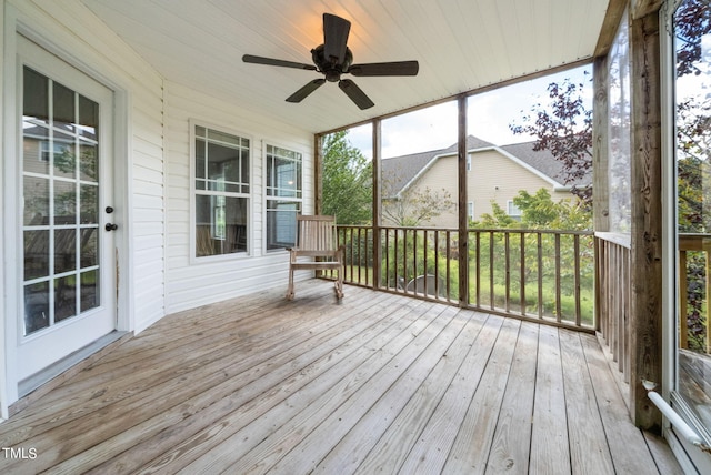 wooden deck featuring ceiling fan