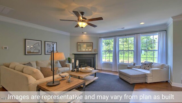 living room featuring wood-type flooring, ornamental molding, and ceiling fan