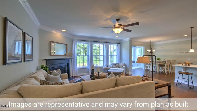 living room featuring ornamental molding, ceiling fan with notable chandelier, and dark hardwood / wood-style flooring