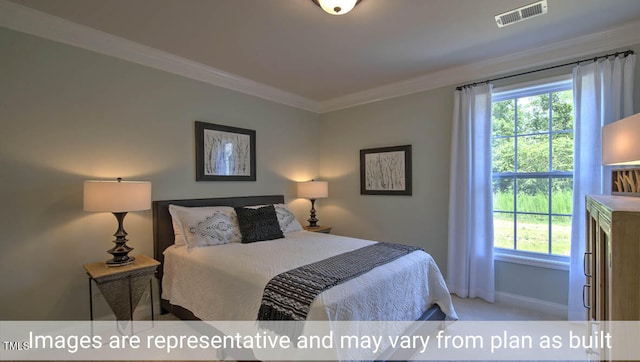 carpeted bedroom featuring crown molding