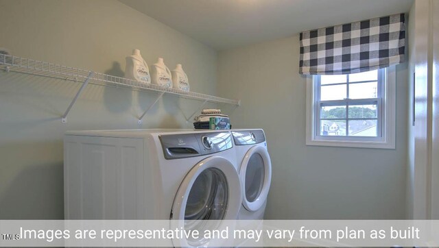 washroom featuring washing machine and clothes dryer