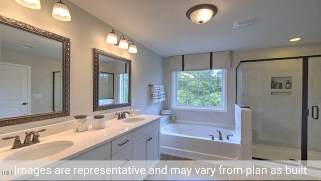 bathroom with plus walk in shower, tile patterned floors, and vanity