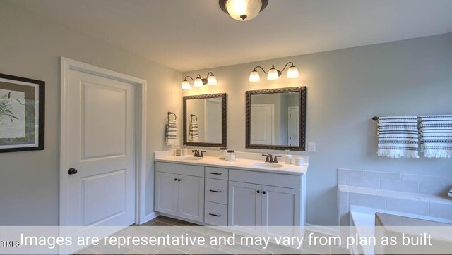 bathroom featuring tile patterned flooring, a bath, and vanity