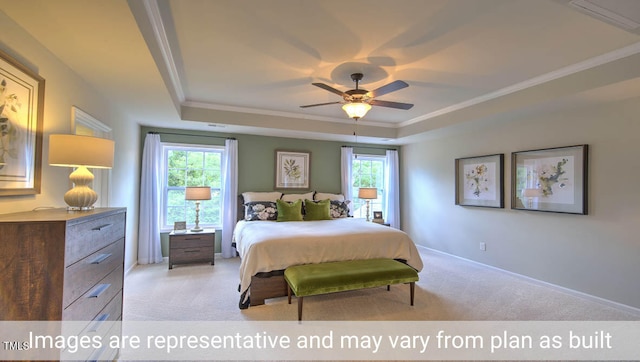 carpeted bedroom with a tray ceiling, multiple windows, ceiling fan, and crown molding